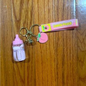 cute peach baby bottle keychain!